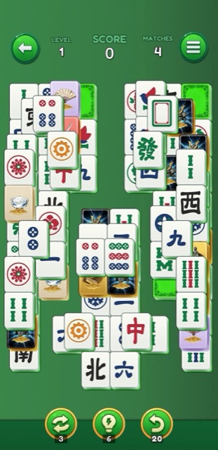 A full mahjong board mid-game, with colorful tiles on a soft green background
